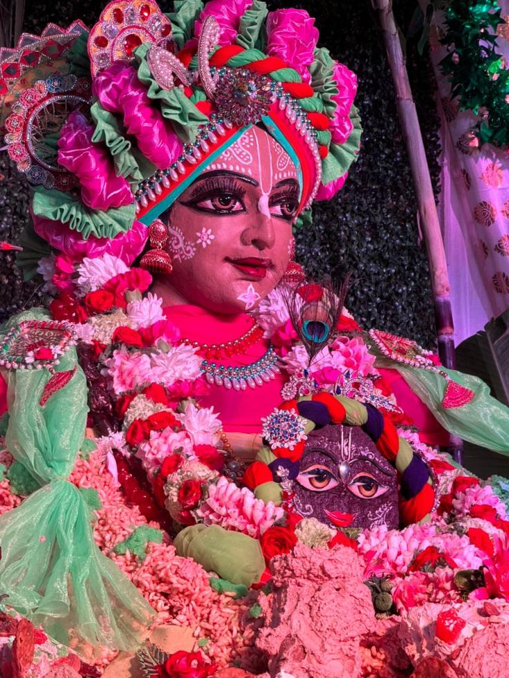 Devotees carrying Govardhana